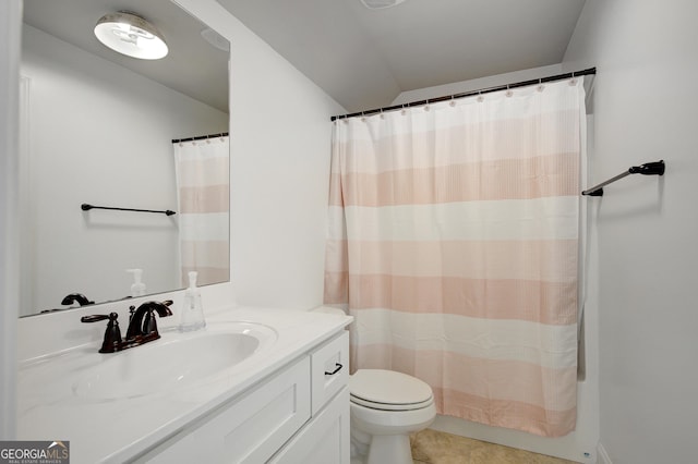 full bath featuring toilet, tile patterned floors, lofted ceiling, and vanity