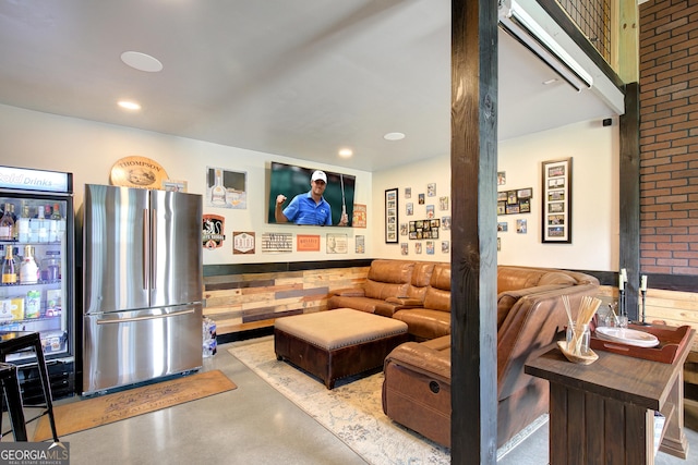 living area featuring recessed lighting and concrete floors