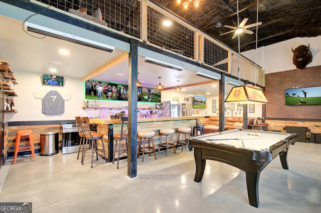 game room featuring ceiling fan, a towering ceiling, finished concrete flooring, pool table, and a community bar