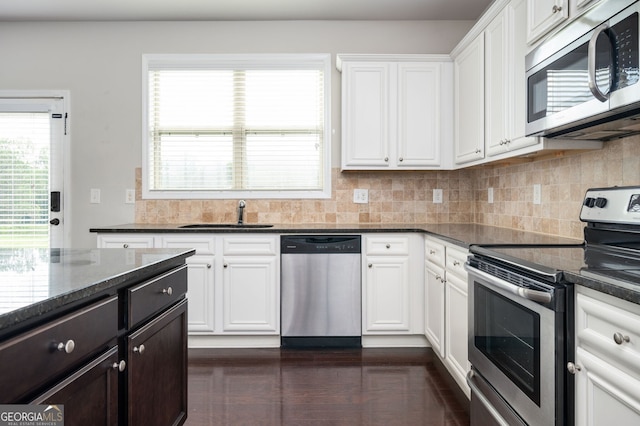 108 Franklin St, Braselton, GA 30517 - kitchen with a sink, backsplash, stainless steel appliances, and white cabinetry