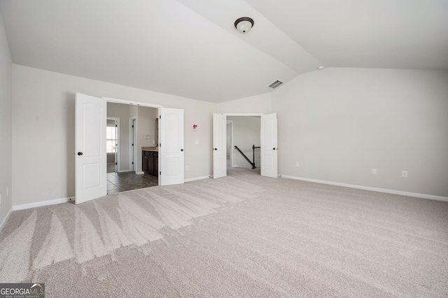 108 Franklin St, Braselton, GA 30517 - unfurnished bedroom with visible vents, carpet, baseboards, and vaulted ceiling