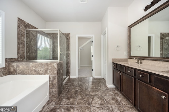 108 Franklin St, Braselton, GA 30517 - bathroom with a garden tub, a shower stall, vanity, baseboards, and a spacious closet