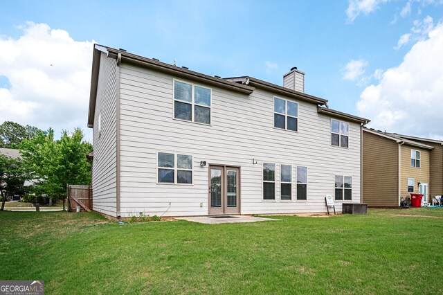 108 Franklin St, Braselton, GA 30517 - rear view of house featuring a lawn, a patio, and a chimney