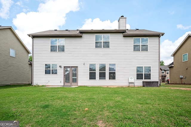 108 Franklin St, Braselton, GA 30517 - back of property featuring a lawn, a chimney, and french doors