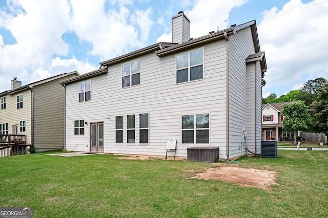 108 Franklin St, Braselton, GA 30517 - back of property with a lawn, central AC unit, and a chimney