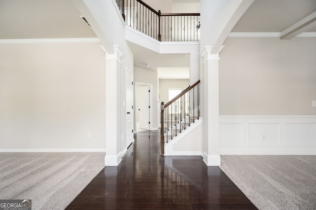 108 Franklin St, Braselton, GA 30517 - entryway with baseboards, wood finished floors, a towering ceiling, ornate columns, and stairway