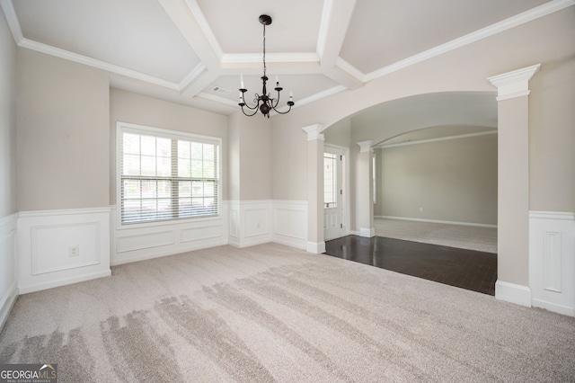 108 Franklin St, Braselton, GA 30517 - carpeted spare room featuring arched walkways, a wainscoted wall, a chandelier, coffered ceiling, and ornate columns