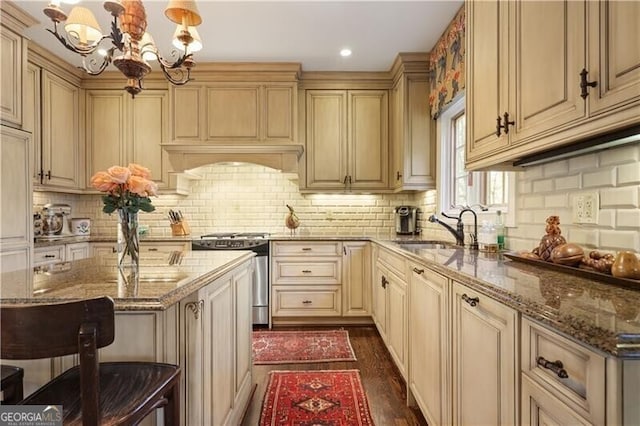 45 Paces W Dr NW, Atlanta, GA 30327 - kitchen with dark wood-style flooring, stove, dark stone countertops, and a chandelier