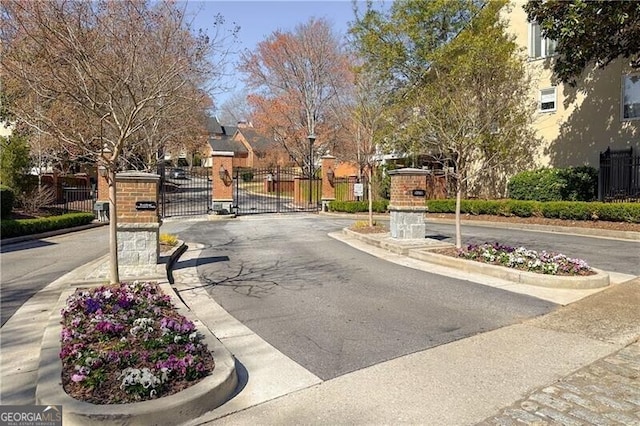 45 Paces W Dr NW, Atlanta, GA 30327 - view of road featuring curbs, a gate, street lights, a gated entry, and a residential view