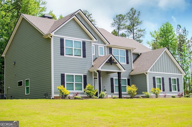 445 Boulder Crest Trl, Villa Rica, GA 30180 - craftsman-style home with board and batten siding, a front yard, and a shingled roof