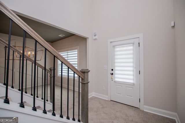 445 Boulder Crest Trl, Villa Rica, GA 30180 - carpeted entrance foyer featuring baseboards and stairs