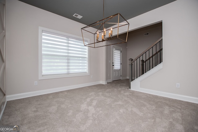 445 Boulder Crest Trl, Villa Rica, GA 30180 - entryway featuring carpet flooring, a chandelier, plenty of natural light, and stairway
