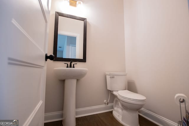 445 Boulder Crest Trl, Villa Rica, GA 30180 - half bathroom with baseboards and wood finished floors