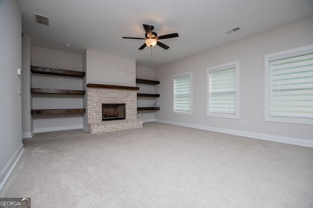 445 Boulder Crest Trl, Villa Rica, GA 30180 - unfurnished living room featuring carpet flooring, ceiling fan, and a brick fireplace