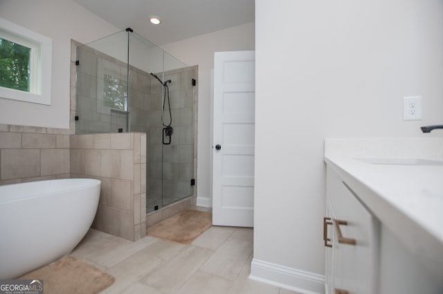 445 Boulder Crest Trl, Villa Rica, GA 30180 - full bath with a shower stall, a freestanding bath, vanity, tile patterned floors, and recessed lighting