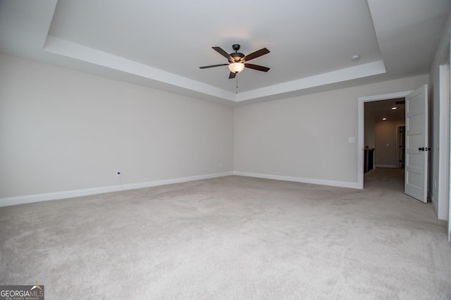 445 Boulder Crest Trl, Villa Rica, GA 30180 - spare room featuring a raised ceiling, ceiling fan, and light carpet