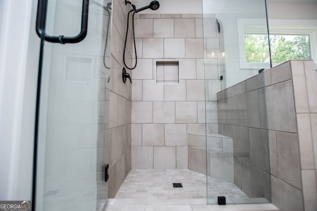 full bath with a shower stall