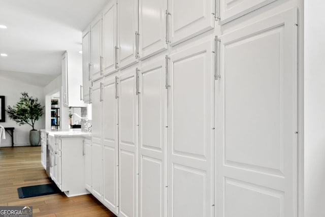 interior space featuring recessed lighting and wood finished floors