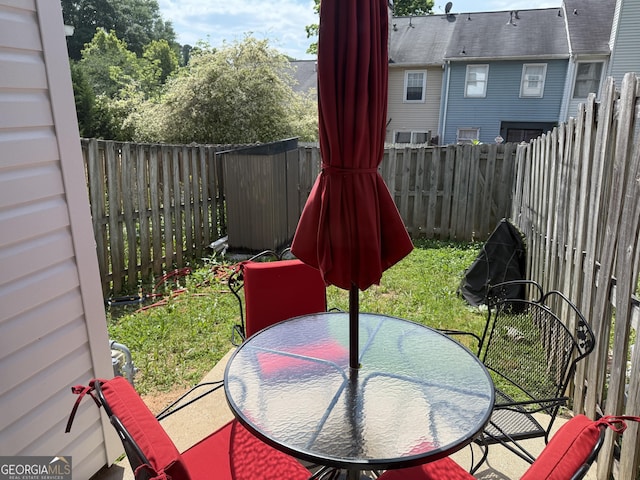 2353 Wellington Cir, Lithonia, GA 30058 - view of patio with a fenced backyard and outdoor dining space