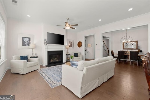 1074 Heyward Way, Alpharetta, GA 30009 - living room featuring visible vents, wood finished floors, stairway, recessed lighting, and ceiling fan with notable chandelier
