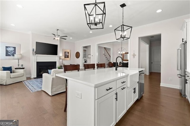 1074 Heyward Way, Alpharetta, GA 30009 - kitchen featuring a kitchen bar, a center island with sink, a sink, stainless steel appliances, and recessed lighting