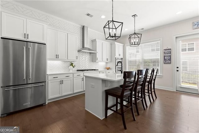 1074 Heyward Way, Alpharetta, GA 30009 - kitchen with visible vents, tasteful backsplash, black stovetop, high quality fridge, and wall chimney exhaust hood