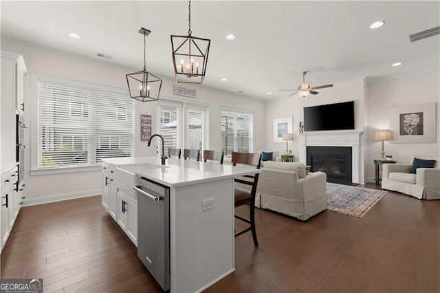 1074 Heyward Way, Alpharetta, GA 30009 - kitchen with a kitchen breakfast bar, visible vents, dishwasher, white cabinets, and a glass covered fireplace