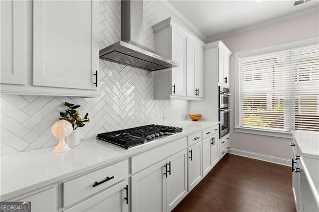 1074 Heyward Way, Alpharetta, GA 30009 - kitchen with dark wood-style flooring, wall chimney range hood, light countertops, white cabinetry, and appliances with stainless steel finishes