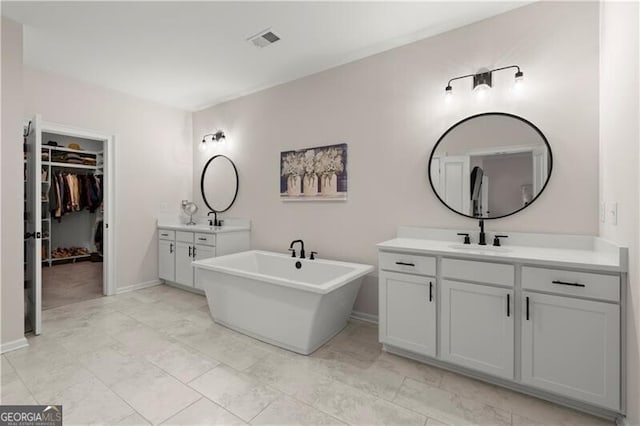 1074 Heyward Way, Alpharetta, GA 30009 - full bath featuring visible vents, a sink, a freestanding bath, and two vanities