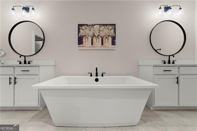 1074 Heyward Way, Alpharetta, GA 30009 - bathroom featuring a sink, two vanities, and a soaking tub