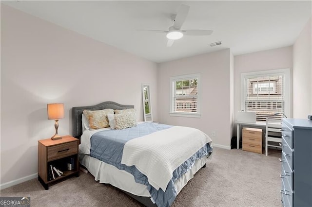 1074 Heyward Way, Alpharetta, GA 30009 - bedroom with baseboards, light colored carpet, ceiling fan, and visible vents