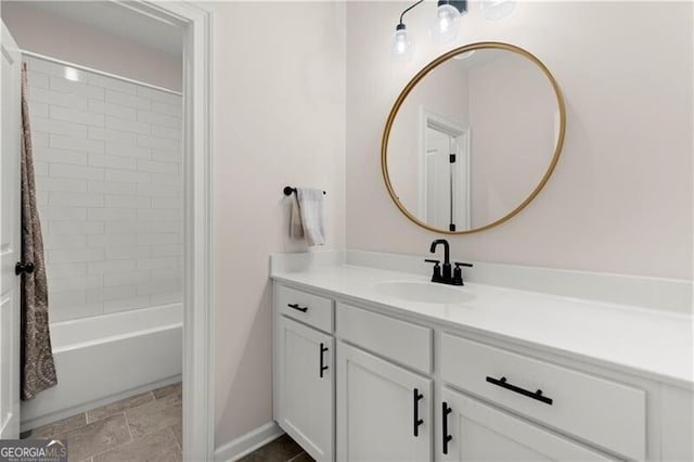1074 Heyward Way, Alpharetta, GA 30009 - bathroom with shower / bath combo with shower curtain, baseboards, stone finish floor, and vanity
