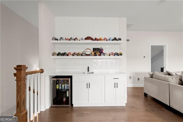 1074 Heyward Way, Alpharetta, GA 30009 - bar with decorative backsplash, wet bar, wine cooler, and wood finished floors