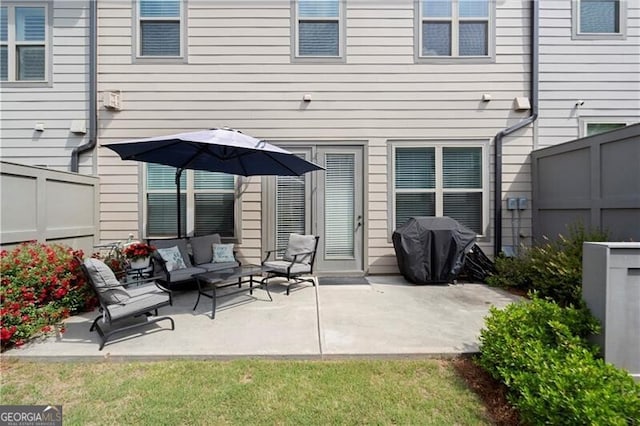 1074 Heyward Way, Alpharetta, GA 30009 - back of property featuring fence, an outdoor hangout area, and a patio area