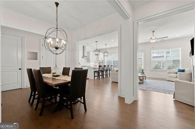 1074 Heyward Way, Alpharetta, GA 30009 - dining area with ornamental molding, ceiling fan with notable chandelier, and dark wood-style floors