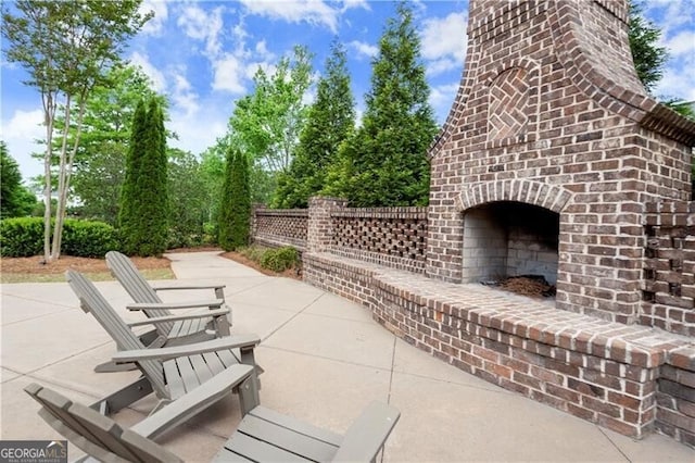 1074 Heyward Way, Alpharetta, GA 30009 - view of patio featuring an outdoor brick fireplace