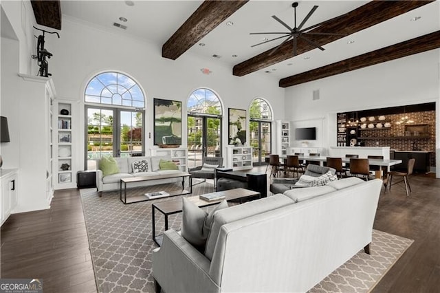 1074 Heyward Way, Alpharetta, GA 30009 - living room with visible vents, beamed ceiling, a high ceiling, dark wood-type flooring, and a ceiling fan