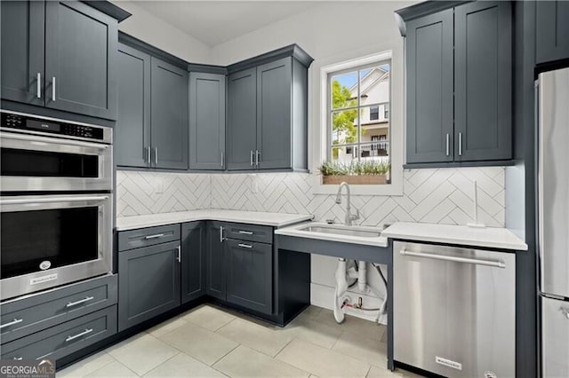 1074 Heyward Way, Alpharetta, GA 30009 - kitchen featuring light countertops, stainless steel appliances, light tile patterned flooring, and tasteful backsplash