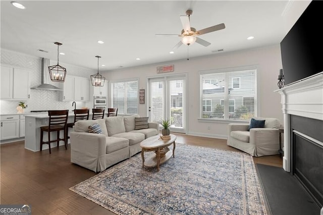 1074 Heyward Way, Alpharetta, GA 30009 - living room featuring recessed lighting, ceiling fan, dark wood finished floors, and a fireplace with flush hearth
