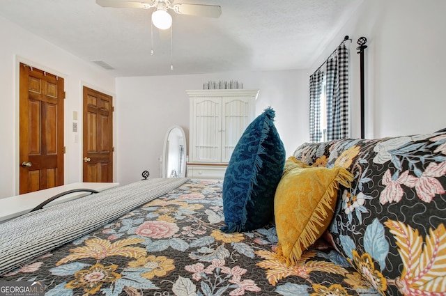 bedroom with a ceiling fan and visible vents
