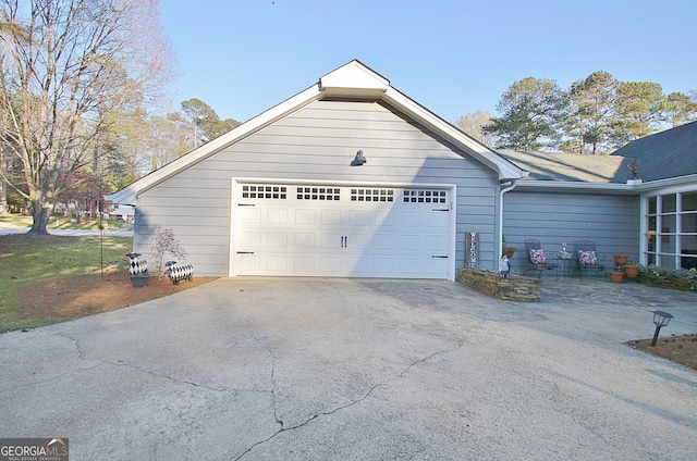 view of home's exterior with a garage and driveway