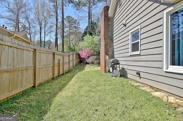 view of yard featuring a fenced backyard