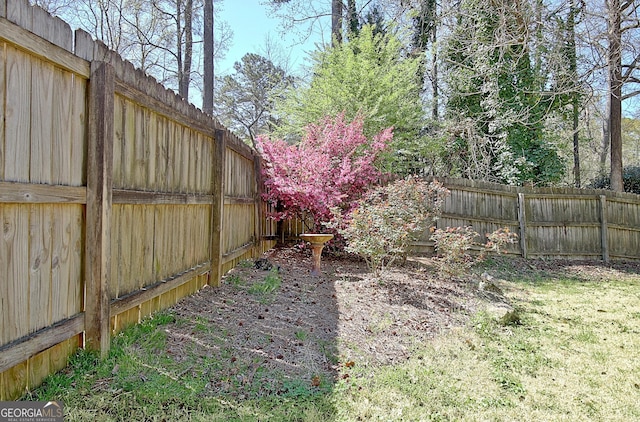 view of yard with a fenced backyard