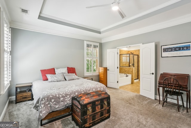 carpeted bedroom featuring visible vents, crown molding, baseboards, ceiling fan, and connected bathroom
