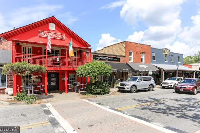 view of building exterior featuring uncovered parking