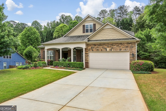 craftsman inspired home featuring a garage, a front lawn, roof with shingles, a porch, and driveway