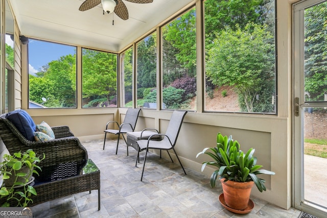 sunroom with a ceiling fan