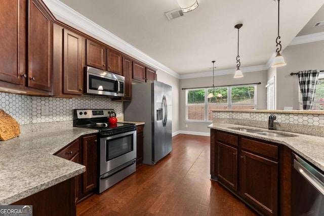 1929 Windstone Pl, Winder, GA 30680 - kitchen with visible vents, decorative backsplash, dark wood-type flooring, a sink, and appliances with stainless steel finishes