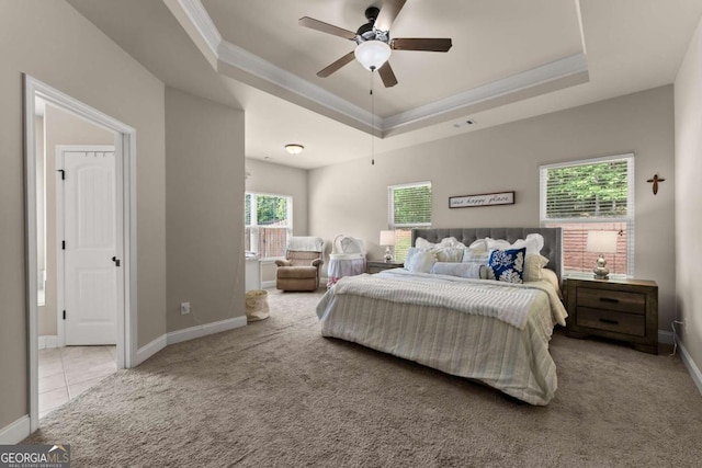1929 Windstone Pl, Winder, GA 30680 - bedroom with ceiling fan, carpet, baseboards, a tray ceiling, and ornamental molding