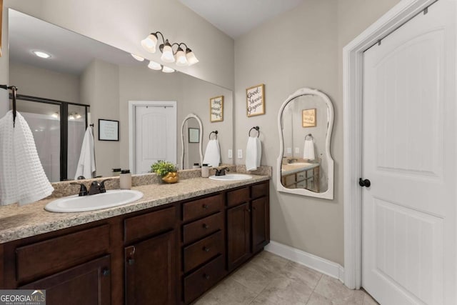 1929 Windstone Pl, Winder, GA 30680 - full bathroom featuring a sink, baseboards, tile patterned flooring, and double vanity